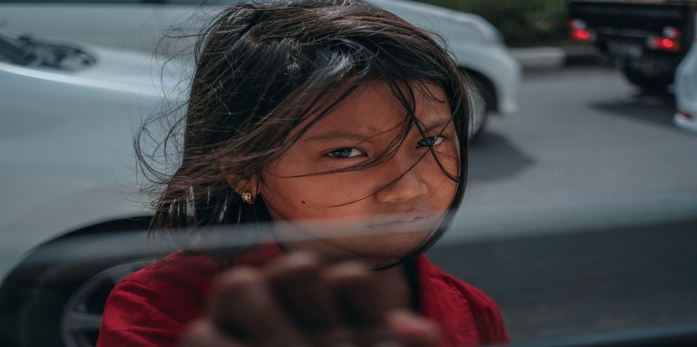A child with dark hair
Description automatically generated